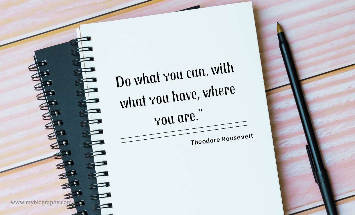 Someone writing in a notebook with simple tools, showing how to start where you are with what you have.